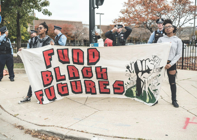 A group of people holding the sign Fund Black Futures