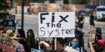 Fix the system protest sign